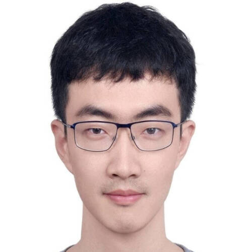Dr. Tiehang Duan is looking straight into the camera. He is wearing spectacles